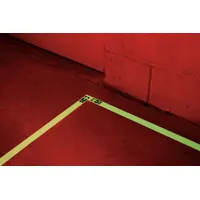 White arrow tape with photoluminescent vinyl backing for low-light directional guidance. Measures 1 inch by 30 feet with 16 mil thickness. No legend message. Used to mark pathways, exits, and safety zones in industrial environments