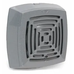 This indoor vibrating horn operates on 24V AC and produces a loud audible signal for alerting personnel in industrial facilities, warehouses, and commercial buildings. It is commonly used in fire alarm systems, process control warnings, and general signaling applications. The horn has a gray finish and measures 5 inches in length by 5 inches in width.