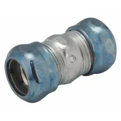 This steel compression conduit coupling connects two lengths of EMT conduit in electrical raceway systems. It has a 1 1/2 in trade size, 2 25/32 in overall length, zinc-plated finish, and includes a clamp. The coupling is rain tight and complies with UL 514B standards.