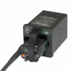 This travel charger is designed for APX series radios, charging one radio at a time. It operates on 12 V DC input, suitable for mobile or field use in vehicles or portable power setups.