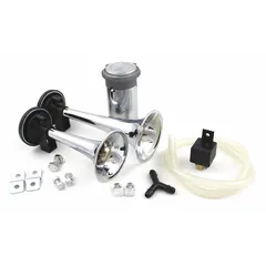 FIAMM air-powered horn kit delivering a full tone with two chrome-plated trumpet horns in silver. Designed for use on RVs and other large vehicles requiring a loud warning signal. Operates on 12V DC.