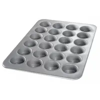 This muffin pan is made of aluminized steel with a 26 ga gauge and a silver finish. It features 24 slots and an overall width of 17 7/8 inches. Suitable for baking muffins, cupcakes, or egg bites in commercial or high-volume home kitchens