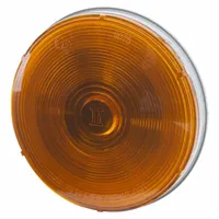 Incandescent turn signal light with amber round lens and 4 5/16 in overall diameter. Features permanent grommet mount and pigtail electrical connection. Complies with FMVSS 108 standards. Used on trucks, trailers, and heavy equipment for turn signal indication