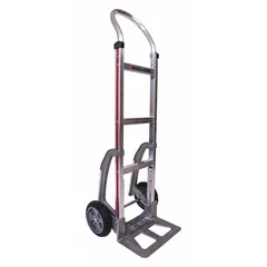 Flow-back hand truck with silver aluminum frame and tread-on-core rubber wheels. Suitable for moving loads in environments where corrosion resistance is required, such as food processing or chemical plants.