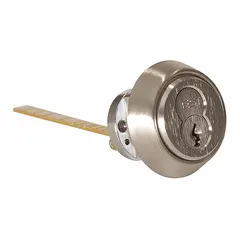 This rim cylinder features an interchangeable core with 7 pins and a chrome finish. It includes a mounting plate and is designed for rim-type lock assemblies. Suitable for commercial doors requiring a keyed-alike or master-keyed system.