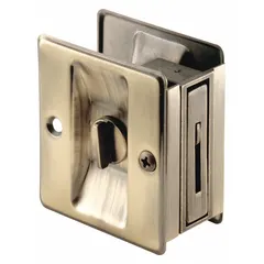 This PRIME-LINE pocket door pull handle is a tray/lever style made of brass with a silver color and antique brass finish. It features unthreaded holes for mounting, suitable for use on cabinets, drawers, or sliding doors where a low-profile pull is required.