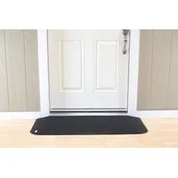This 46-inch-long black rubber ramp provides a smooth transition over door thresholds for wheelchairs, walkers, and carts. It is designed to meet ADA compliance standards for accessibility in commercial and industrial doorways