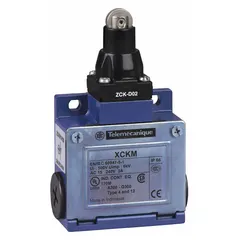 This limit switch from the XCKM series features a top-mount roller-plunger actuator and a non-metallic housing. It uses screw clamp terminals for wiring connections. Typical applications include position detection on conveyors, packaging machinery, and material-handling equipment.