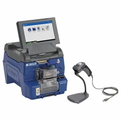 This wraparound label printer and applicator features 300 dpi printhead resolution and auto operation, producing up to 1,000 labels per day. It includes a handheld scanner with stand, a printer ribbon (2 in x 150 ft), and the Brady Workstation Product and Wire ID Software Suite. Typical applications include industrial wire, cable, and product identification.
