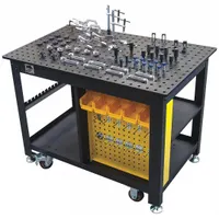 This mobile fixed-height modular welding table features a nitrided surface and a 5/8 in hole pattern for fixturing. With a 48 in width, 30 in depth, and 1,500 lb weight capacity, it supports heavy workpieces in fabrication and assembly tasks. The included fixturing kit enables repeatable setups for precision welding