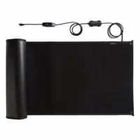 The HEATTRAK HTP36-05 is a 36-inch wide by 5-foot long snow-melting mat designed for walkways, steps, and entry ramps. It operates at 120V AC with a 540W output, has a 1/2-inch thickness, and is black in color. The mat meets CSA 22.2 standards and is intended for permanent installation on concrete or asphalt surfaces to prevent ice and snow accumulation