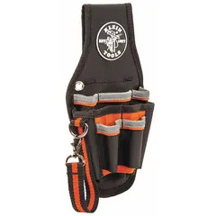 This nylon tool pouch features a ballistic weave construction in black. It has an open-top design with nine pockets and a belt slot attachment for use with belts up to 2 inches wide. The pouch is intended for carrying tape rolls and other small tools, providing organized storage and quick access on a belt.