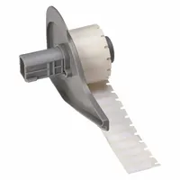 Precut label roll for industrial identification. Polyester material with white gloss finish. Temperature range -40°F to 356°F. Compatible with Brady M710 printer series. Used for labeling electrical panels, cables, and assets in demanding environments