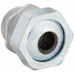 Straight metallic cable grip with steel body and silver finish. Features 1 in MNPT box connection and accepts cord diameters from 0.60 in to 0.70 in. Rated for Class I, Division 2 hazardous locations. Provides strain relief and sealing for wiring in environments where flammable gases or vapors may be present.