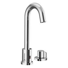 This single-post sensor faucet is constructed from brass with a polished chrome finish. It is battery-operated and includes handles for manual override. The faucet is suited for commercial or high-traffic restroom environments where hands-free operation can improve hygiene and reduce water waste.