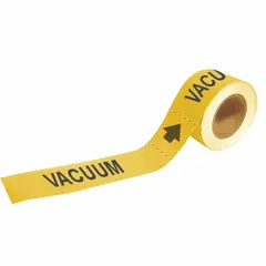 Yellow adhesive pipe marker on a roll with yellow legend reading 'Vacuum' and directional arrows. Designed for pipe outer diameters from 2-1/2 to 6 inches. Each roll contains 25 markers. Used to identify vacuum lines in industrial piping systems for quick content verification.