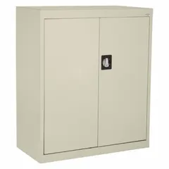 Stationary, assembled cabinet with welded steel construction and tan powder-coated finish. Features a frame base, recessed handle with keyed lock, and two adjustable shelves. Suitable for organized storage of tools, parts, and supplies in industrial environments.