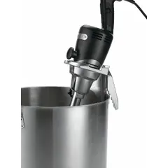 This bowl clamp secures blending containers during operation with compatible immersion blenders. It prevents bowl movement, improving safety and consistency in commercial kitchens and food processing applications. Overall height: 6 inches.