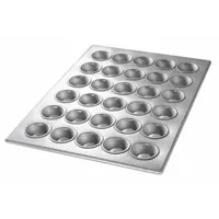 This 30-slot mini muffin pan is made of aluminized steel with a 22 ga gauge and silver finish. It measures 12 7/8 in overall width. Suitable for baking mini muffins or cupcakes in commercial or high-volume kitchens, the aluminized steel construction promotes even heat distribution