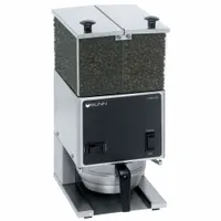 This BUNN portion-control coffee grinder features a two-hopper design and stainless steel construction in a silver finish. It operates on 120V AC and is suited for commercial foodservice environments where precise grinding and high-volume output are required