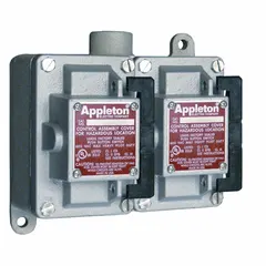 Two-gang front lever tumbler switch rated 20 A at 277 V AC. Single-pole configuration with a dead-end hub and 1-inch hub size. Suitable for industrial lighting and motor control applications requiring enclosed switching.