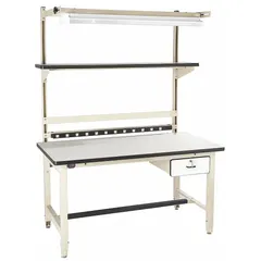 Adjustable-height workstation with a beige laminate top (72 x 30 in) and integrated power, storage, and overhead lighting. Supports an overall load capacity of 5,000 lb. Suitable for assembly, testing, and inspection tasks in industrial and technical environments.