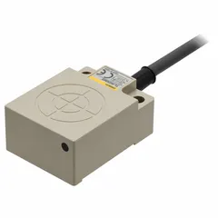 This OMRON inductive rectangular proximity sensor operates on 10-30V DC and features an unshielded design with a 3-wire configuration and non-terminated cable. It is used for non-contact detection of metal objects in industrial automation applications such as position sensing on conveyors, machine tools, and packaging equipment.