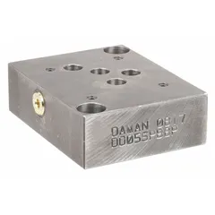 This valve subplate is designed for D05 NFPA size directional control valves. It features a ductile iron body with NPT port connections and a 4-inch overall height. Suitable for hydraulic systems requiring secure fluid routing.