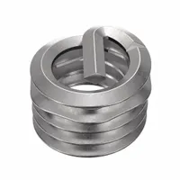 Screw-locking tanged helical insert for repairing or reinforcing tapped threads in metal. Features 5/16"-18 coarse thread, right-hand direction, 18-8 stainless steel with dry film lubricant finish, and tensile strength of 200,000 to 250,000 psi. Supplied in packs of 500