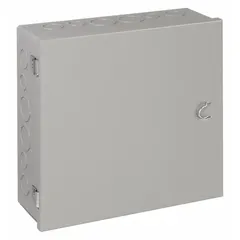 This steel indoor enclosure with a hinged solid cover measures 12 in x 12 in x 4 in and is rated NEMA 1 for general-purpose indoor use. It includes knockouts for conduit entry and secures with clamps. The painted finish provides corrosion resistance. Typical applications include housing terminals, relays, and controls.
