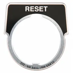 Half-round push-button ring and plate for 30 mm panel mounting. Overall height 1 3/4 in, width 1 5/8 in. Silver aluminum construction with black 'Reset' legend in French. Used in industrial control stations to label reset functions.