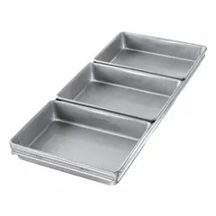 This aluminized steel pan set features three slots for baking cinnamon rolls, package rolls, and similar bread products. The silver finish and 9 7/8 in overall width accommodate standard bakery racks. Aluminized steel construction promotes even heat distribution for consistent browning.