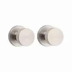 This KWIKSET passage knob lockset is designed for interior doors where locking is not required, such as hall or closet doors. It features a nickel finish and a rose lockset style, with an ANSI Hall function for push-to-open operation. Suitable for residential or light commercial applications.