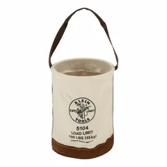Canvas bucket bag in off-white with open top and one pocket. Measures 12 inches wide by 17 inches high. Suitable for carrying tools and materials on job sites, providing quick access and stability on ladders or scaffolding.