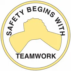 Non-reflective hard hat label with 'Safety Begins With Teamwork' message. 2-inch diameter, English text, universal design. Sold as a 4-pack. Suitable for use on hard hats in industrial environments to promote safety awareness.