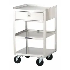 This mobile equipment stand is constructed from stainless steel with a silver cabinet and drawer, providing corrosion resistance for medical environments. It is equipped with four swivel casters for easy repositioning of equipment in hospitals, laboratories, and similar settings.