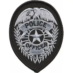 Sew-on embroidered badge measuring 2 3/4 in x 3 3/4 in, constructed of plastic with a black and gold color scheme. Designed for attachment to uniforms, tactical vests, or gear for identification purposes.
