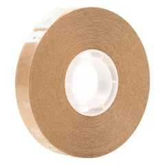 This reverse-wound adhesive transfer tape features a transparent acrylic adhesive on a kraft paper liner, with a permanent bond type. It is 36 yards long and 1.7 mil thick. Used for industrial assembly, splicing, and mounting applications requiring a thin, clear adhesive layer.