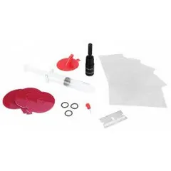 This automotive-grade plastic windshield repair kit is designed for repairing chips and cracks in vehicle windshields. The compact set measures 2 19/64 inches long, 3 13/64 inches wide, and 8 inches high, making it suitable for use in workshops or by mobile technicians.