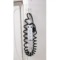 Steel outlet strip with white powder-coated finish, includes a 15 ft cord with three-prong plug and mounting bracket. Overall width 1 1/2 in. Designed for power distribution on medical carts and mobile workstations in healthcare settings.