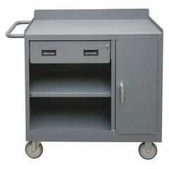 This mobile cabinet bench is constructed of steel with a gray finish and includes open storage, drawers, and shelves. It has an overall load capacity of 1200 lb and is fully assembled. A handle on the side facilitates movement. Suitable for industrial workshops, maintenance facilities, and assembly lines for organizing tools and parts.