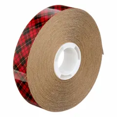 3M 969 is a reverse-wound adhesive transfer tape with a permanent acrylic adhesive on a transparent carrier. It is 3/4 inch wide, 36 yards long, and 5 mil thick, supplied in a 48-pack with a kraft paper liner. This tape is used for bonding films, foils, and labels in industrial assembly and graphics applications where a clean, permanent bond is required.