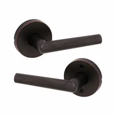 Storeroom lever lockset with rose style, satin bronze-plated finish over zinc with blackened and satin relieved accents, clear coated. ANSI function F75 (hall) allows key-only entry from outside and free egress inside. ADA compliant. Suitable for hallways, storage rooms, and offices where privacy is not required.