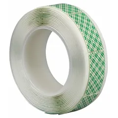 Double-sided foam tape strip with open-cell polyurethane foam core and permanent acrylic adhesive. Measures 1 inch wide by 3 inches long, 62.5 mil thick, tan color. Used for mounting and assembly applications where conformability and permanent bonding are required.