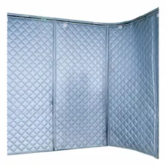 Track-mounted hanging acoustic curtain with a 1 in thickness, 12 ft overall length, and 4 ft overall width. Features a curved panel shape and includes a curved track. Used for noise reduction in industrial environments such as manufacturing plants and machine shops.