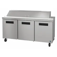 This HOSHIZAKI refrigerated prep table offers 18 cu ft of cold storage with three doors, providing accessible ingredient storage beneath a worktop surface for food preparation. It features thermostatic control and is suited for commercial kitchen environments such as restaurants and cafeterias.