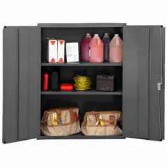 Welded steel frame cabinet with powder-coated gray finish. Includes two adjustable shelves and a swing handle with keyed lock. Panel thickness is 14 ga. Suitable for secure storage of tools, parts, and equipment in industrial environments such as warehouses and factories.