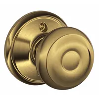 This dummy knob lockset is a non-latching, non-locking trim set designed for use on the inactive leaf of a pair of doors, providing a pull function only. Constructed in brass with a Georgian style, it serves as a decorative pull for doors that remain fixed