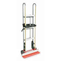This general purpose appliance hand truck features a vertical dual-loop frame in red and silver. It is equipped with 6-inch diameter tread-on-core wheels and a ratchet strap tightening mechanism. Suitable for moving heavy appliances and equipment in warehouses, retail stores, and delivery operations.
