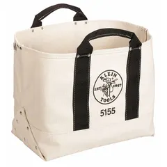 This black canvas tool tote measures 16-1/2 inches wide by 9 inches deep by 12-1/2 inches high. It has no pockets and is made of canvas, providing open-top storage for carrying hand tools and supplies on job sites.